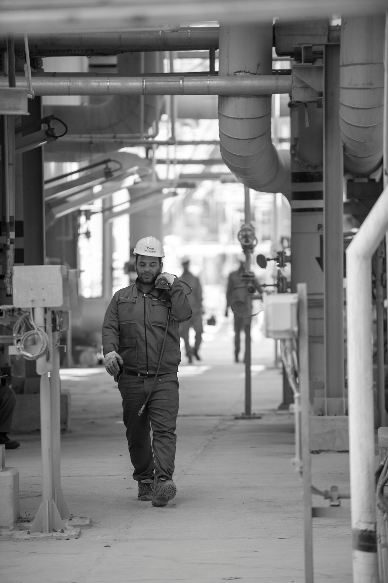 Operator walking through a process plant